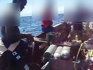 Working dhow with scuba cylinders racked along the gunwale, Mkokotoni channel, Zanzibar 2007